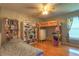 Cozy bedroom with a loft bed, desk, bookcase, and bright window at 313 Oak Crest Dr, Safety Harbor, FL 34695