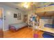 Bedroom featuring a loft bed, desk, bookcase, and hardwood floors at 313 Oak Crest Dr, Safety Harbor, FL 34695