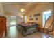 Bright bedroom with light colored walls, tile flooring, closet, and french door access to the outdoor pool at 313 Oak Crest Dr, Safety Harbor, FL 34695