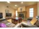 Inviting living room with a stone fireplace and comfortable seating, creating a warm and relaxing atmosphere at 313 Oak Crest Dr, Safety Harbor, FL 34695