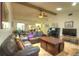 Spacious living area featuring tile floors and an open layout connecting to the kitchen, perfect for Gathering gatherings at 313 Oak Crest Dr, Safety Harbor, FL 34695