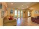 Living room with vaulted ceilings, light colored walls, light floors, and multiple windows for natural light at 313 Oak Crest Dr, Safety Harbor, FL 34695
