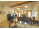 Bright and airy living space featuring tile floors, a vaulted ceiling, and a stone fireplace, offering a cozy ambiance at 313 Oak Crest Dr, Safety Harbor, FL 34695