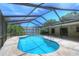 Enjoy the outdoors in this screened-in pool with ample patio space for entertaining Gathering and friends at 313 Oak Crest Dr, Safety Harbor, FL 34695
