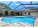 The screened-in pool offers an escape with plentiful seating, perfect for warm weather enjoyment and outdoor gatherings at 313 Oak Crest Dr, Safety Harbor, FL 34695