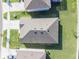 An aerial view shows the roof with well-maintained landscaping at 33488 Elm Hill Br, Wesley Chapel, FL 33545