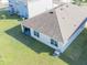 An aerial view showcases the large backyard with a covered patio at 33488 Elm Hill Br, Wesley Chapel, FL 33545
