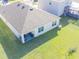 Aerial view of the property highlighting the roof, backyard, and outdoor patio seating area at 33488 Elm Hill Br, Wesley Chapel, FL 33545