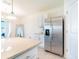 Modern kitchen with stainless steel refrigerator and ample counter space at 33488 Elm Hill Br, Wesley Chapel, FL 33545