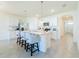 Open kitchen featuring stainless steel appliances, granite countertops, and a breakfast bar at 33488 Elm Hill Br, Wesley Chapel, FL 33545