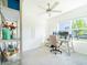 Bright home office with a ceiling fan, large window, and simple decor at 33488 Elm Hill Br, Wesley Chapel, FL 33545