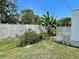Backyard featuring tropical plants and well-maintained landscaping at 34041 Azalea N Dr, Pinellas Park, FL 33781