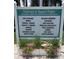 Welcome to Sunset Palms 55+ retirement community sign displaying planned activities and beautiful flower box underneath at 34041 Azalea N Dr, Pinellas Park, FL 33781