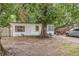 Cozy single-story home featuring a large tree in the front yard at 3424 16Th E St, Bradenton, FL 34208