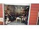 Open garage filled with furniture, equipment, tools, and decor, offering lots of storage at 3424 16Th E St, Bradenton, FL 34208
