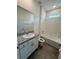 Bathroom features a granite-topped vanity and a shower-tub combo with tiled walls at 3504 Crooked River Dr, Plant City, FL 33565