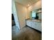 Bright bathroom featuring double sink vanity with granite countertop and tile flooring at 3504 Crooked River Dr, Plant City, FL 33565