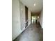 Modern entryway featuring decorative wall paneling, sleek tile floors, and recessed lighting at 3504 Crooked River Dr, Plant City, FL 33565