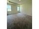 Large main bedroom with tray ceiling, carpeting, and plenty of natural light from the windows at 3504 Crooked River Dr, Plant City, FL 33565