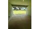 Covered patio featuring view of expansive lawn, mature trees, and black metal fencing at 3504 Crooked River Dr, Plant City, FL 33565