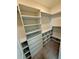 Walk-in closet with many shelves, drawers and ample hanging space at 3504 Crooked River Dr, Plant City, FL 33565
