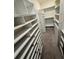 Spacious walk-in closet featuring shelving and hanging rods for optimal storage at 3504 Crooked River Dr, Plant City, FL 33565