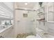 Bright bathroom featuring decorative mosaic shower, floating shelves, and stone vanity top at 3966 High Bluff Dr, Largo, FL 33770