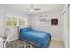 A bright bedroom featuring large windows, neutral walls, and comfortable living at 3966 High Bluff Dr, Largo, FL 33770