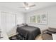 This cozy bedroom features a ceiling fan, natural light, and stylish decor at 3966 High Bluff Dr, Largo, FL 33770