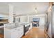 Updated kitchen featuring stainless steel appliances, an island with bar seating, and an open-concept design at 3966 High Bluff Dr, Largo, FL 33770