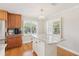 Well-lit kitchen with granite countertops, stainless steel appliances, a center island, and plantation shutters at 3966 High Bluff Dr, Largo, FL 33770