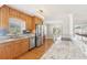 Bright kitchen featuring granite countertops, stainless steel appliances, hardwood floors, and ample natural light at 3966 High Bluff Dr, Largo, FL 33770