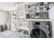Well-equipped laundry room with modern washer/dryer, sink, and storage at 3966 High Bluff Dr, Largo, FL 33770