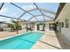 Sparkling pool inside screened lanai perfect for relaxing and entertaining at 3966 High Bluff Dr, Largo, FL 33770