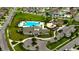 A clubhouse with a large pool, playground, and well-maintained landscaping at 4023 Wild Senna Blvd, Tampa, FL 33619