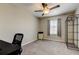Bright bedroom with ceiling fan, neutral walls, window with blinds, and carpeted floor at 4023 Wild Senna Blvd, Tampa, FL 33619
