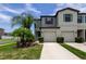 Charming townhome exterior with lush landscaping and a well-maintained front lawn at 4023 Wild Senna Blvd, Tampa, FL 33619