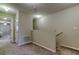 Bright hallway with neutral decor, leading to other rooms, and featuring staircase access at 4023 Wild Senna Blvd, Tampa, FL 33619