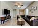 Open-concept living area with tile flooring and modern furnishings at 4023 Wild Senna Blvd, Tampa, FL 33619