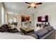 Comfortable living room featuring a ceiling fan and open access to the kitchen at 4023 Wild Senna Blvd, Tampa, FL 33619