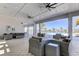 The outdoor lounge area with comfortable seating, ceiling fans, and views of the pool at 4023 Wild Senna Blvd, Tampa, FL 33619