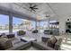 A covered outdoor lounge area with comfortable seating and ceiling fans at 4023 Wild Senna Blvd, Tampa, FL 33619