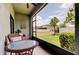 A screened-in patio with outdoor furniture and a view of the neighborhood at 4023 Wild Senna Blvd, Tampa, FL 33619