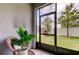 A screened-in patio has nice views of the manicured lawn at 4023 Wild Senna Blvd, Tampa, FL 33619