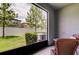 The view from the screened-in patio shows a well-maintained lawn at 4023 Wild Senna Blvd, Tampa, FL 33619