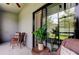 A screened-in patio has outdoor furniture and is adjacent to the home at 4023 Wild Senna Blvd, Tampa, FL 33619