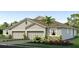 Charming single-story home with a two-car garage, stone accents and attractive landscaping at 4027 Westwood Fields Loop, Plant City, FL 33565
