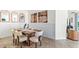 Elegant dining room with stylish decor, set table, and natural light, perfect for gatherings at 4031 Westwood Fields Loop, Plant City, FL 33565