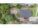 Aerial shot showcasing the backyard layout, including a brick patio and firepit area at 4205 N Suwanee Ave, Tampa, FL 33603