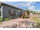 Charming backyard with brick patio and access stairs leading up to a wood deck at 4205 N Suwanee Ave, Tampa, FL 33603